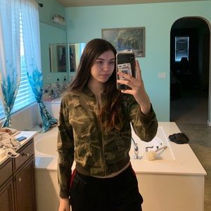 Distressed camouflage jacket